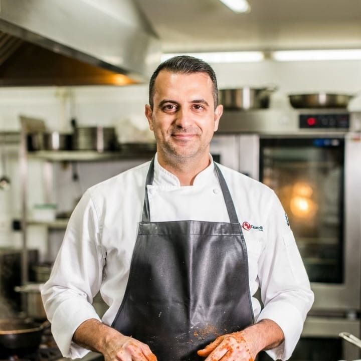 Chef Marco, World Kitchen, an AI character on folk